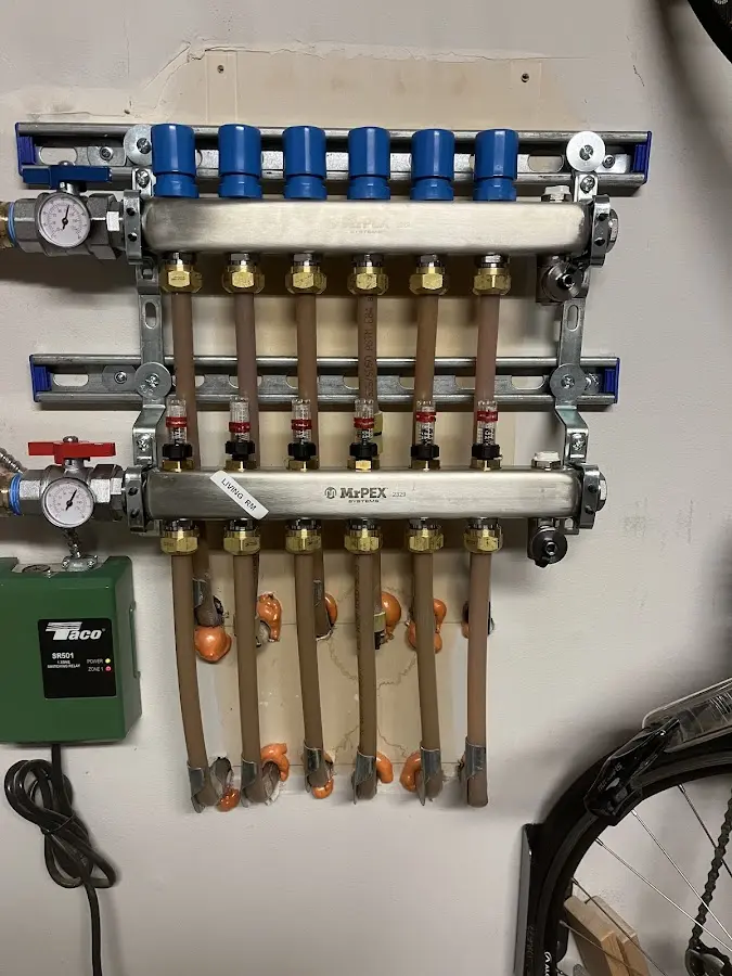 Plumber performing Water Heater Repair at a residential property in Lawrence